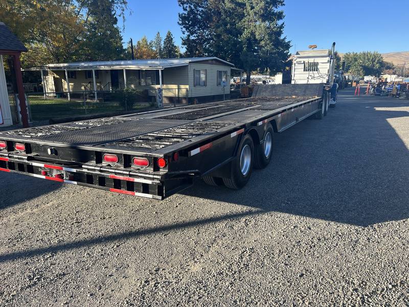 1984 Trail Ezee 42 ft hydraulic tail equipment trailer. (CN 3)